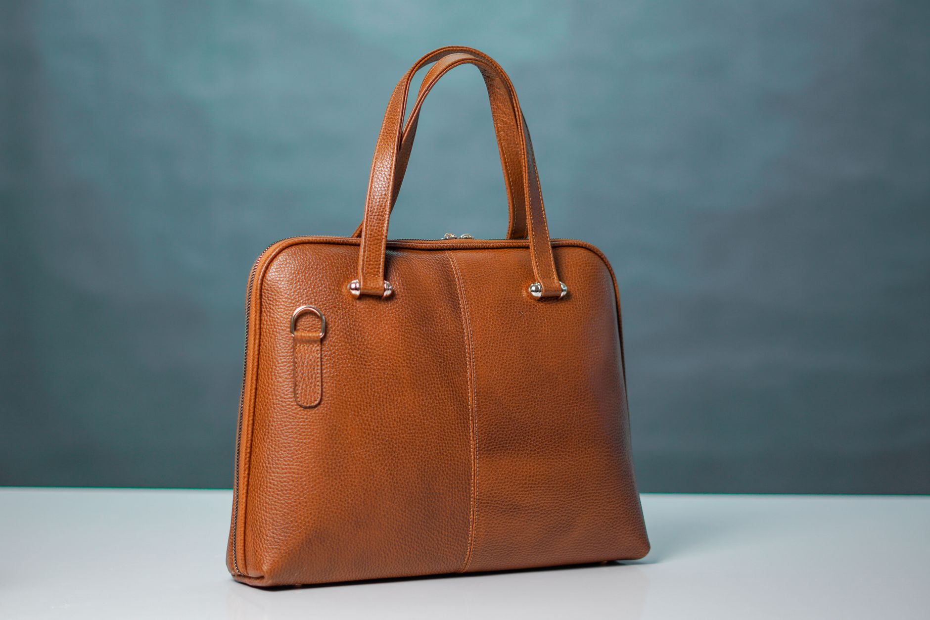 A high street brown leather handbag close up