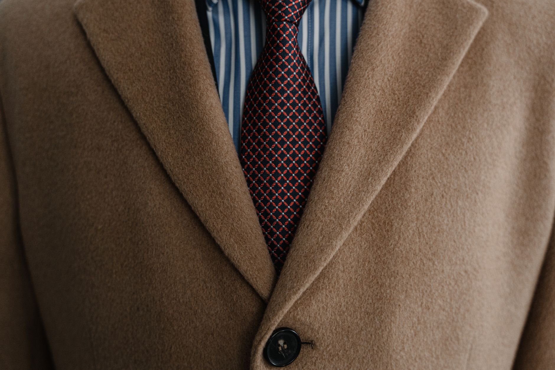Close up of a coat with visible seams and lapel