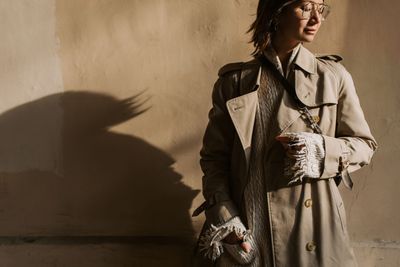 An editorial autumn coat in neutral tones