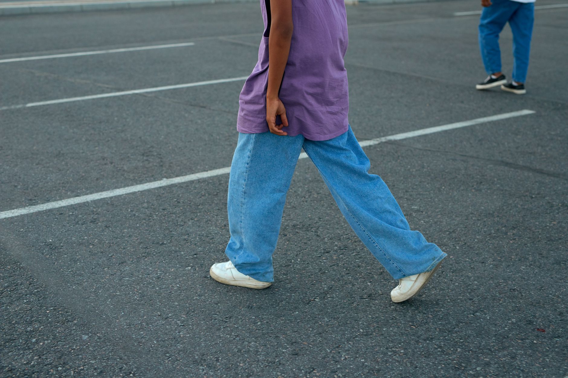 Woman wearing wide leg barrel jeans