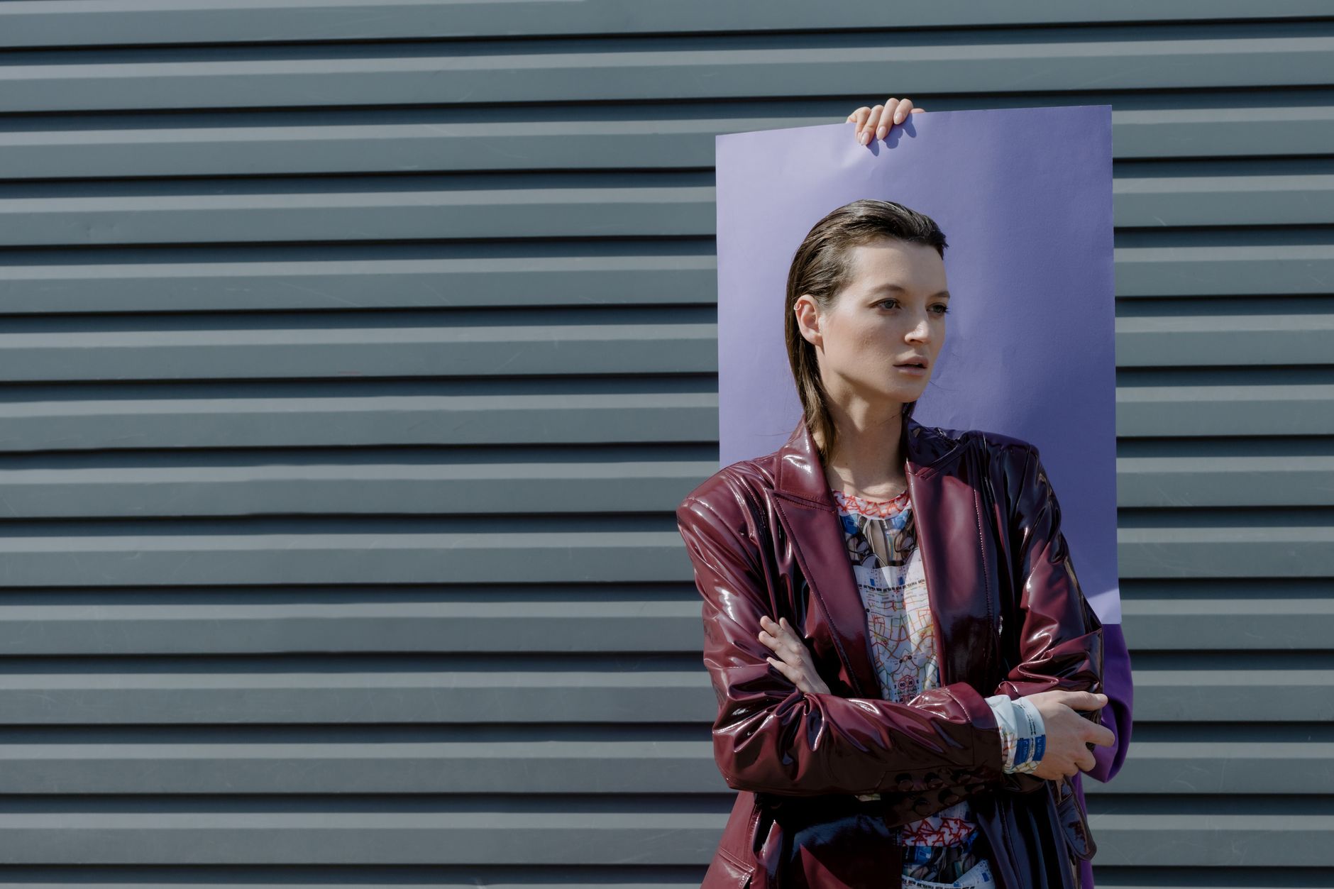 A burgundy outfit shot in editorial autumn light