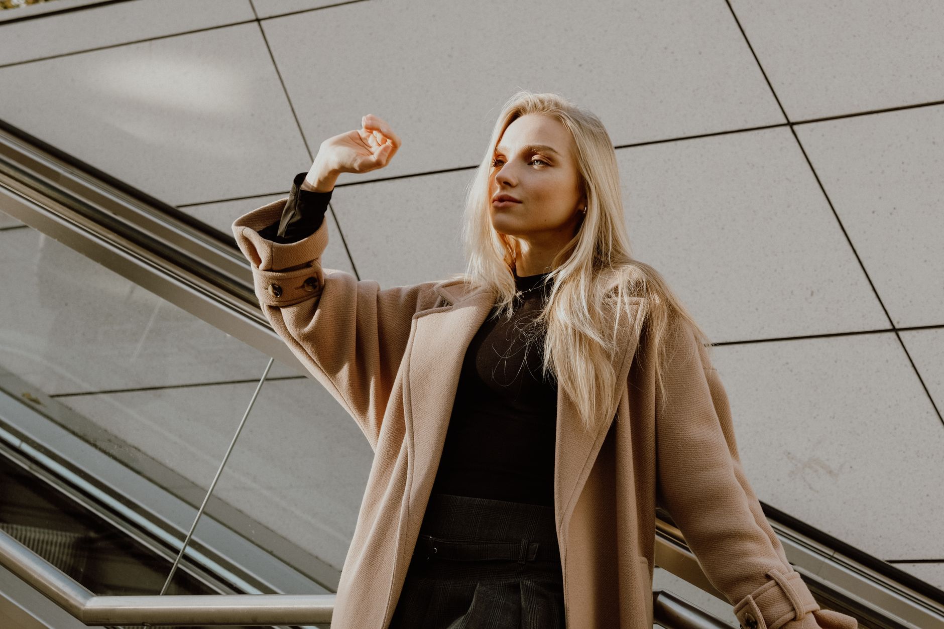 A model on a runway in a wool coat