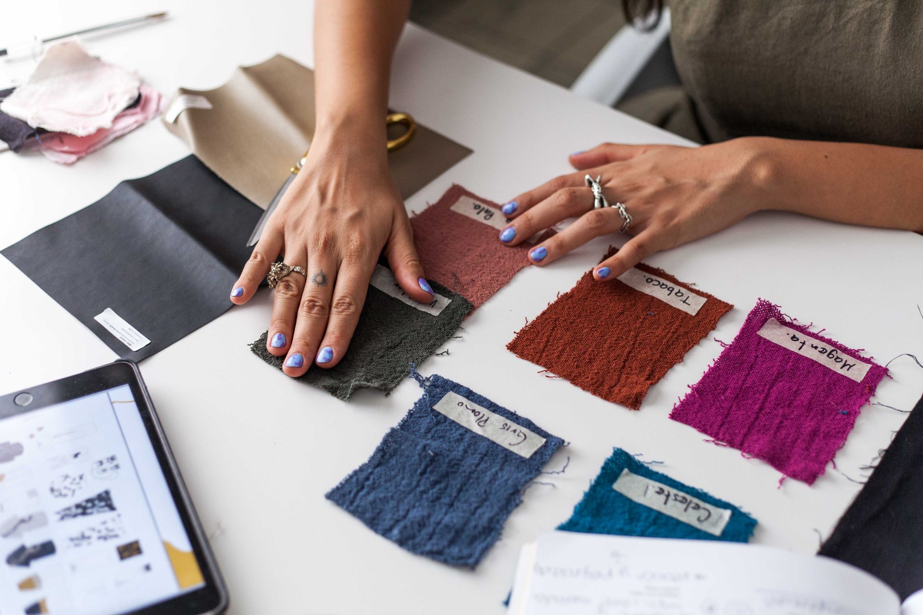 A fashion designer in a studio with fabric