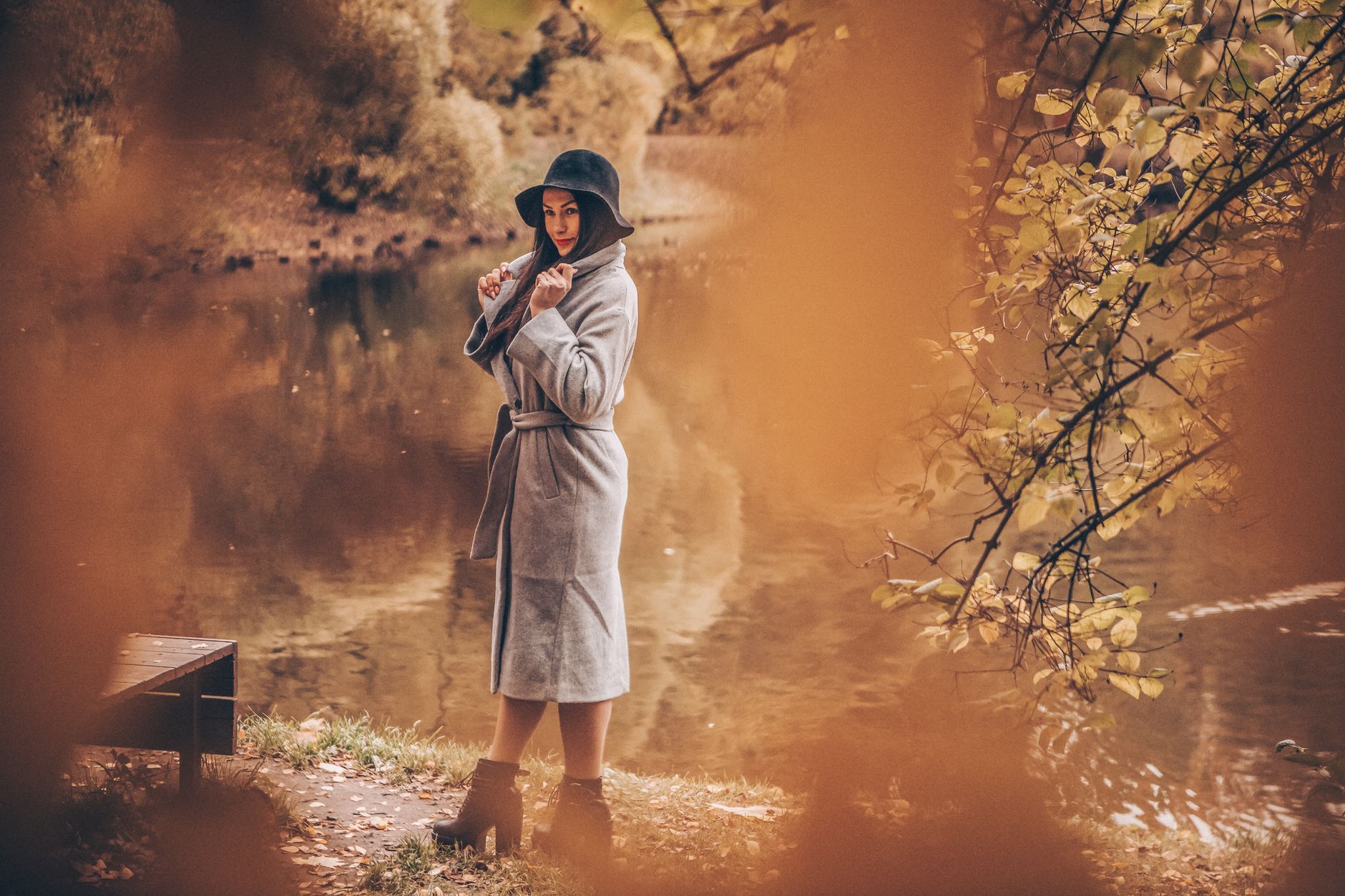 A minimal autumn outfit shot outdoors