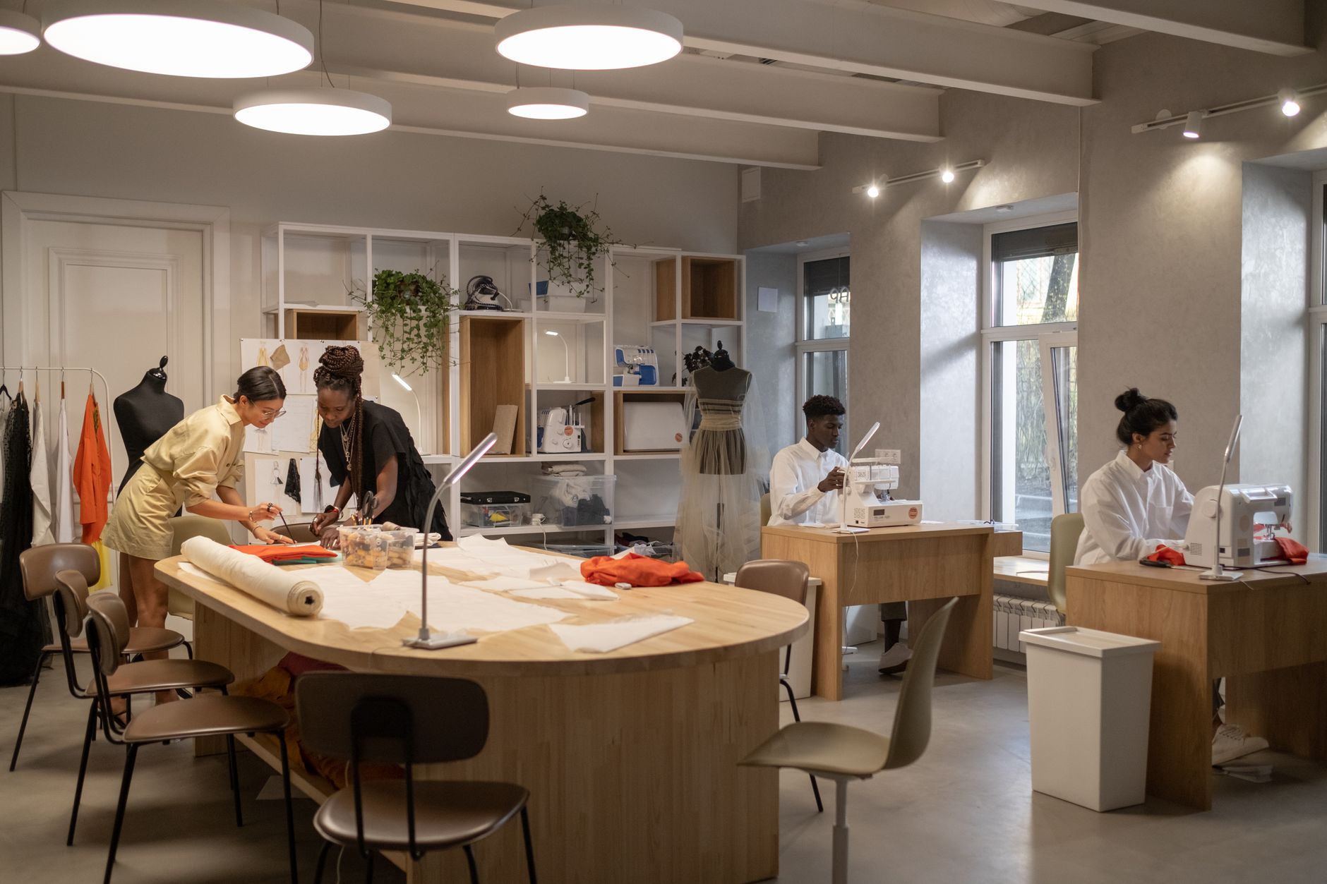 A designer sketching in a fashion atelier