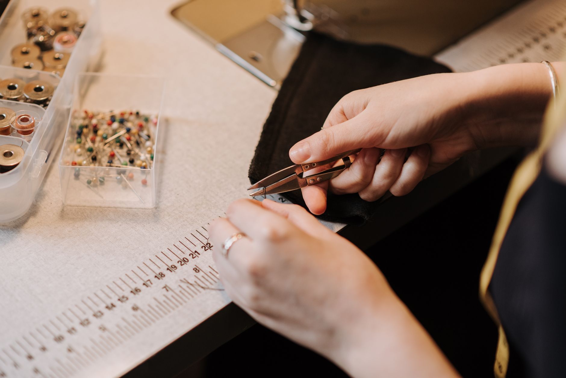 Couture atelier hands stitching fabric