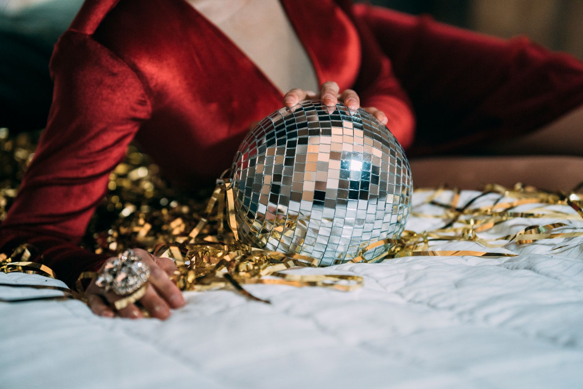 A party outfit with accessories on a bed