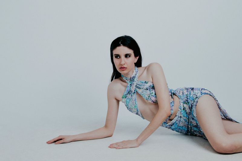An editorial sequin dress in evening light