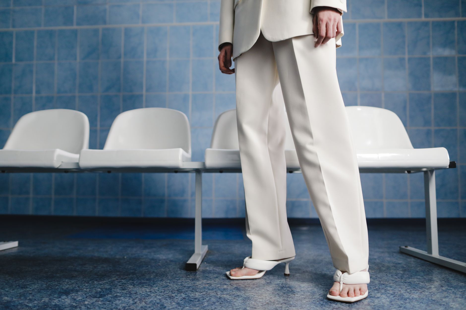 A blazer and trousers on a chair