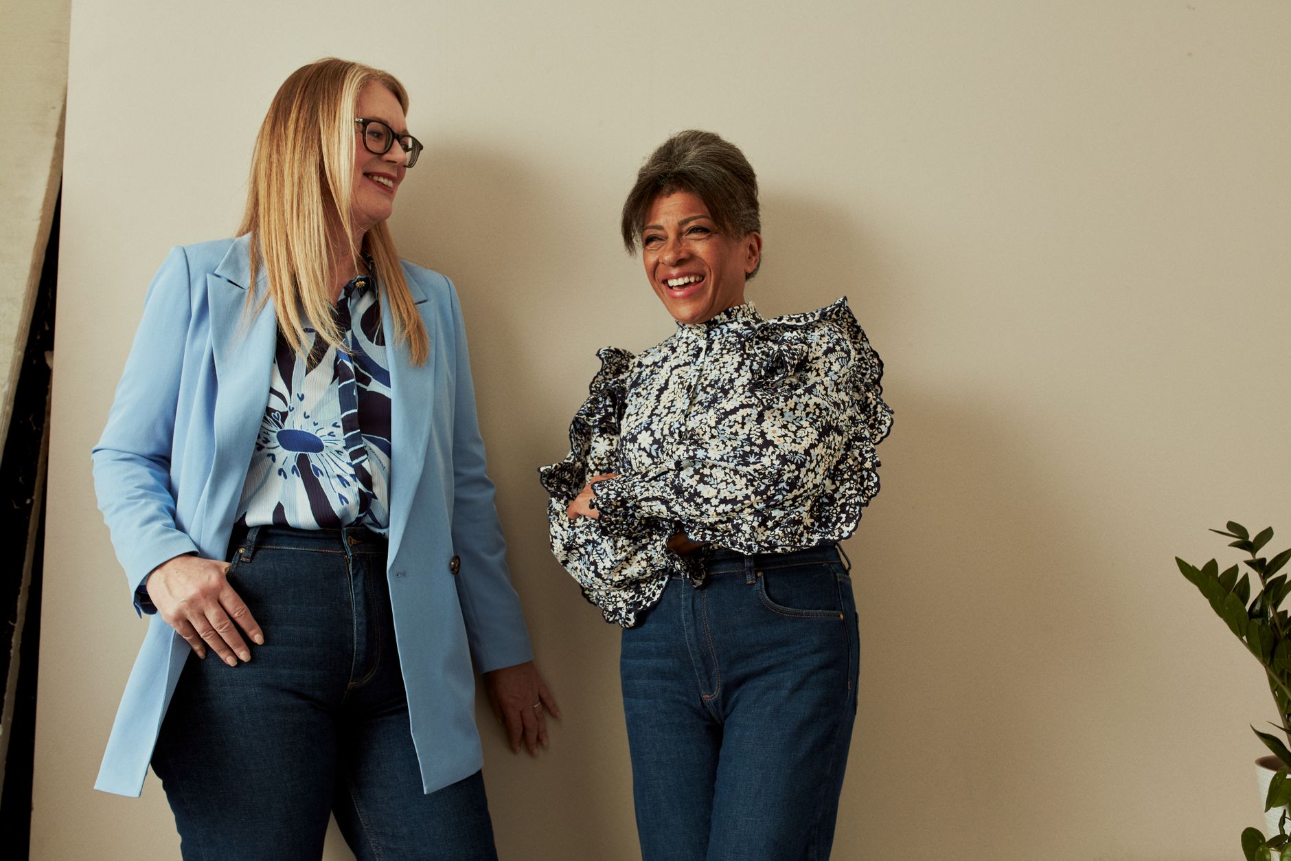 Editorial layering with a sheer top under a blazer