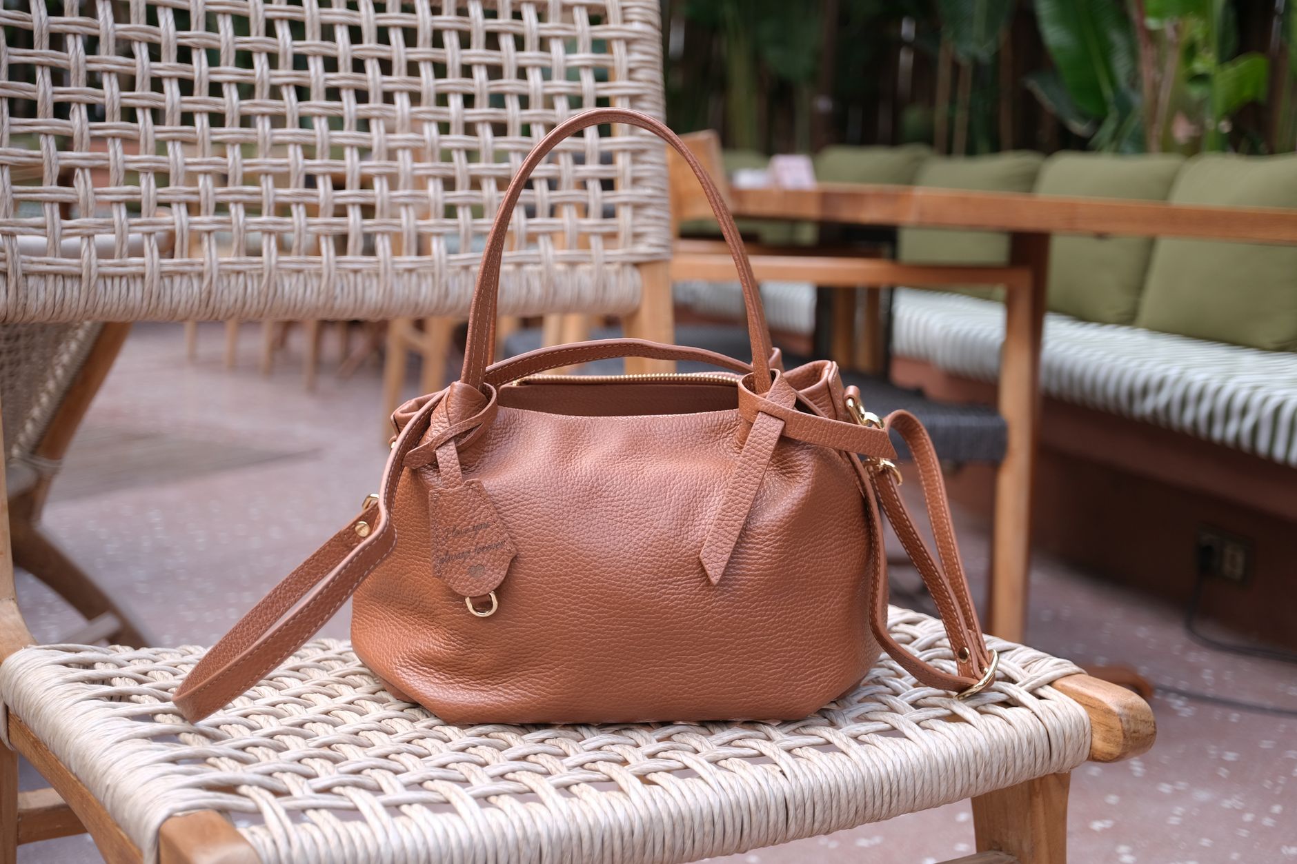 Warm brown leather bag conveying luxury autumn texture