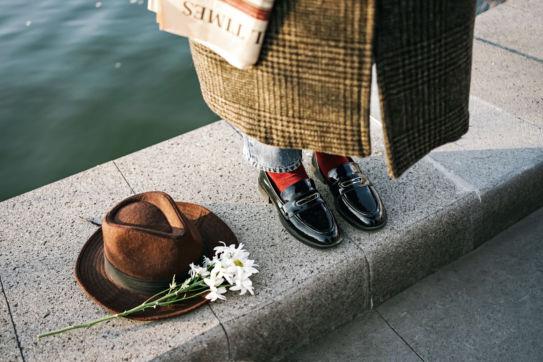 Woman wearing loafers in a chic outfit