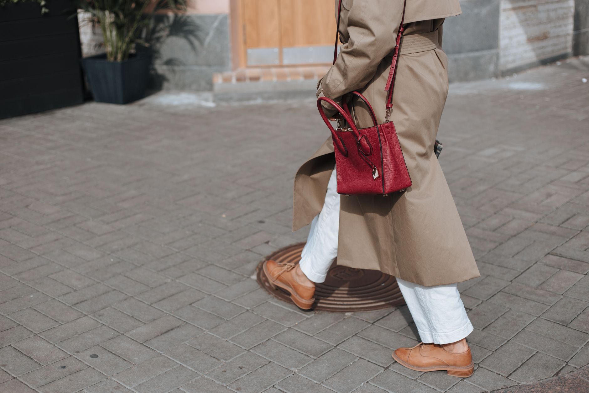 A neutral quiet luxury outfit shot outdoors